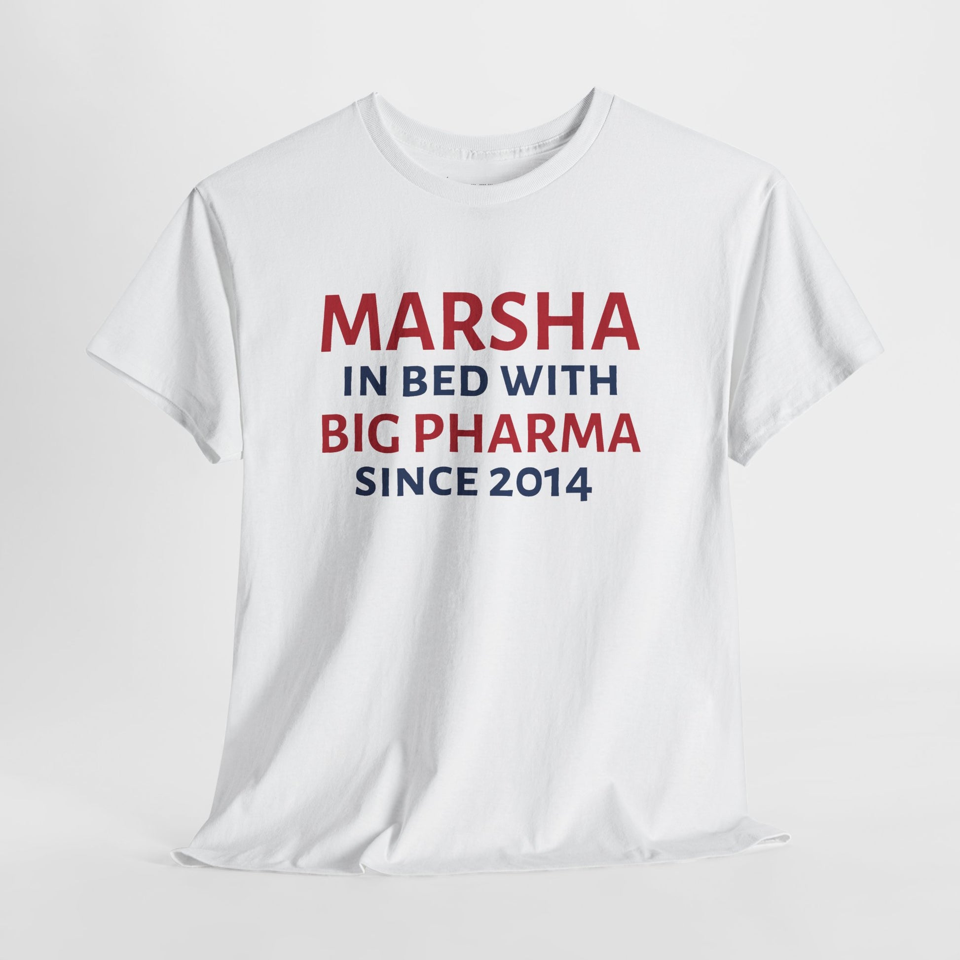 A white short-sleeve crewneck t-shirt with a red and navy blue text graphic on the front reading 'MARSHA IN BED WITH BIG PHARMA SINCE 2014'.
