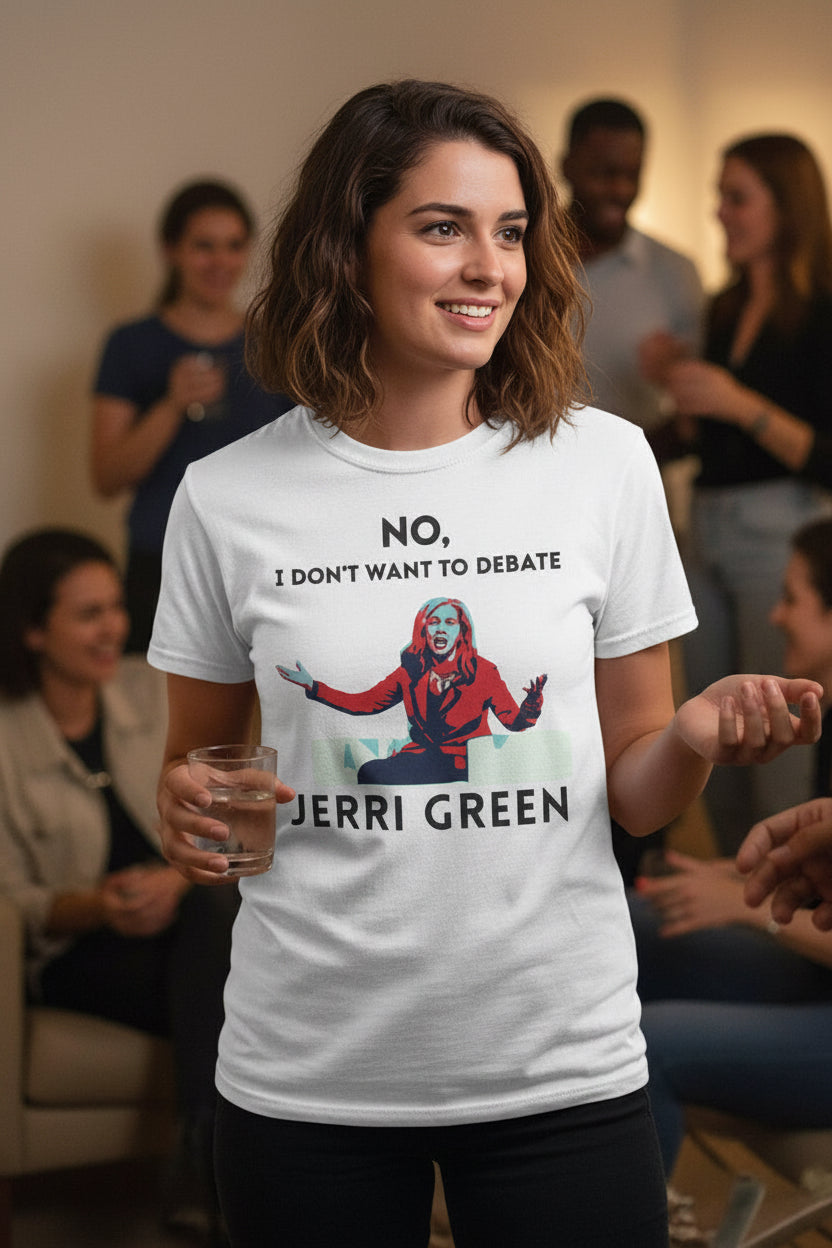 A woman standing in a social setting wearing a white t-shirt with graphic of Marsha Blackburn and text 'No, I don't want to debate Jerri Green' in black on a white background. 